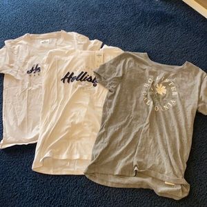 3 hollister graphic top bundle two white one grey